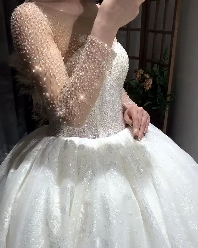 Ruffled - skirt wedding dress for a romantic lookBling Long Sleeves Ball Gown Wedding Dresses Beaded Corset Ruffled - skirt wedding dress for a romantic lookBling Long Sleeves Ball Gown Wedding Dresses Beaded Corset