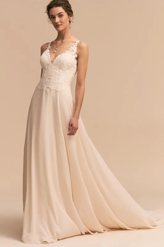 Wedding Dresses with Sheer Sleeve and Sequined Cuffs and Embroidered Bodice and Bow at the Waist for an Elegant and Sparkly LookBHLDN Whispers & Echoes Kirsten Gown Wedding Dresses with Sheer Sleeve and Sequined Cuffs and Embroidered Bodice and Bow at the Waist for an Elegant and Sparkly LookBHLDN Whispers & Echoes Kirsten Gown